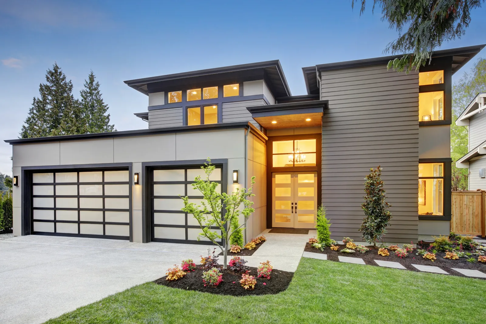 Modern home exterior with contemporary siding, trim, windows, and entry details