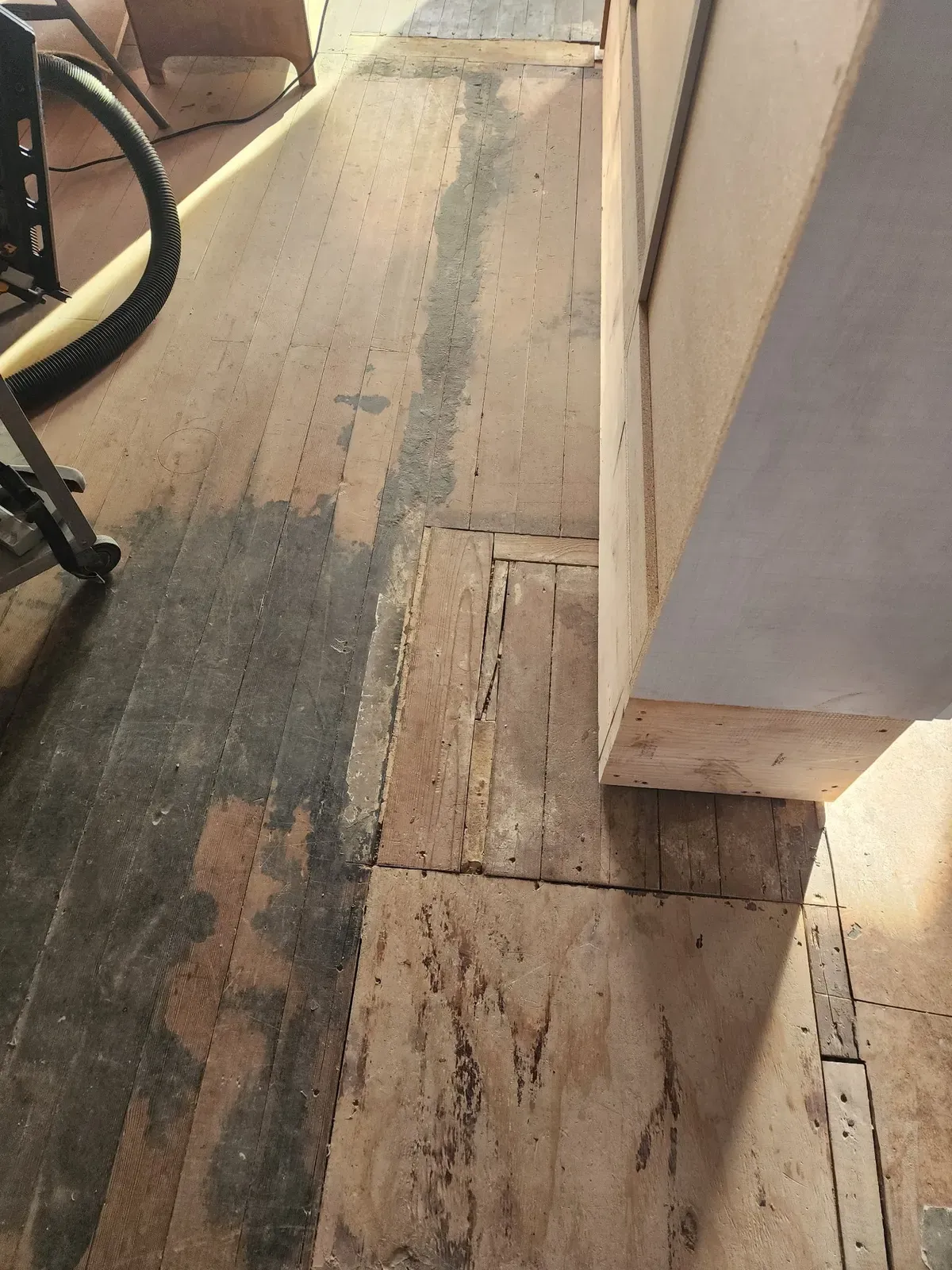 Flooring preparation along an interior wall during the cabin remodel