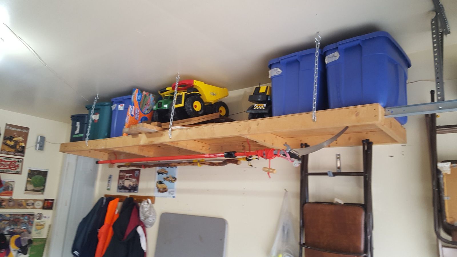 Built overhead storage shelves along a garage wall