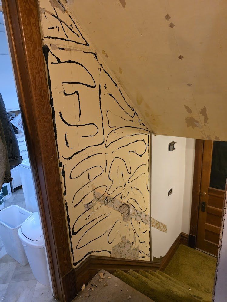Stairwell wall before repair and refinishing