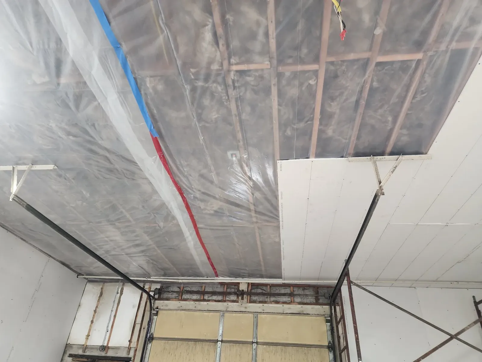 Drywall being installed across the performance center ceiling