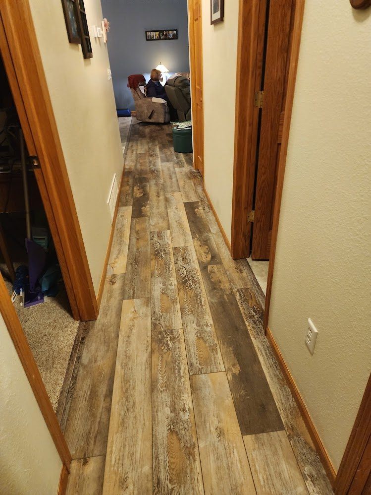 Hallway finished with new wood-look plank flooring