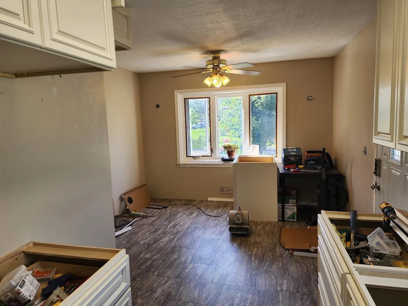 New wood-look plank flooring installed through the kitchen and dining area