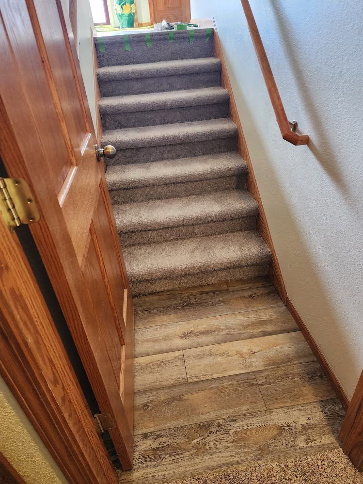 Finished stairwell with newly installed gray carpet