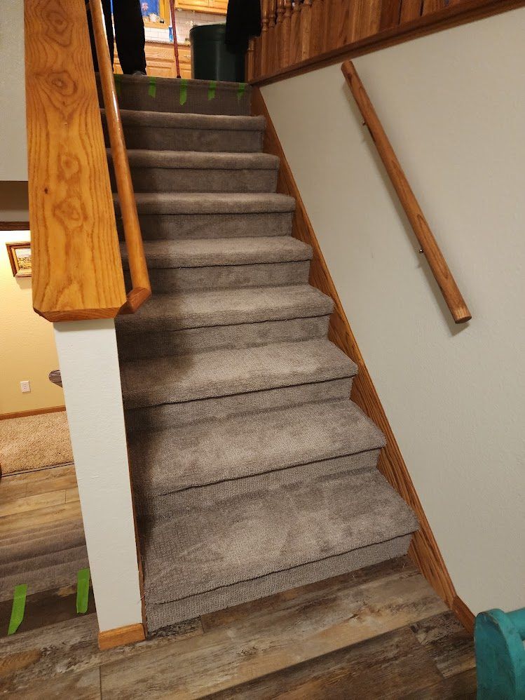Finished carpeted stairwell viewed from the bottom