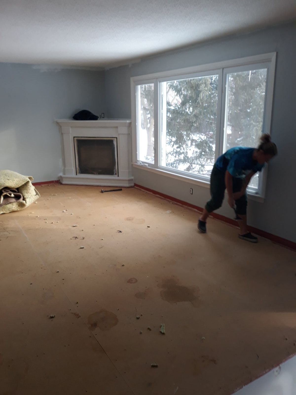 Living room fireplace area during demolition