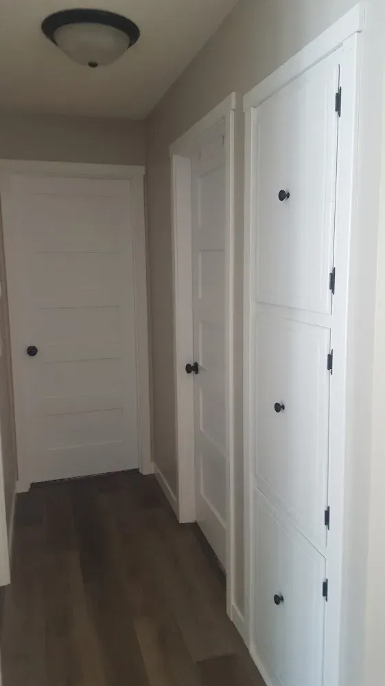 Main floor with newly installed doors and white trim