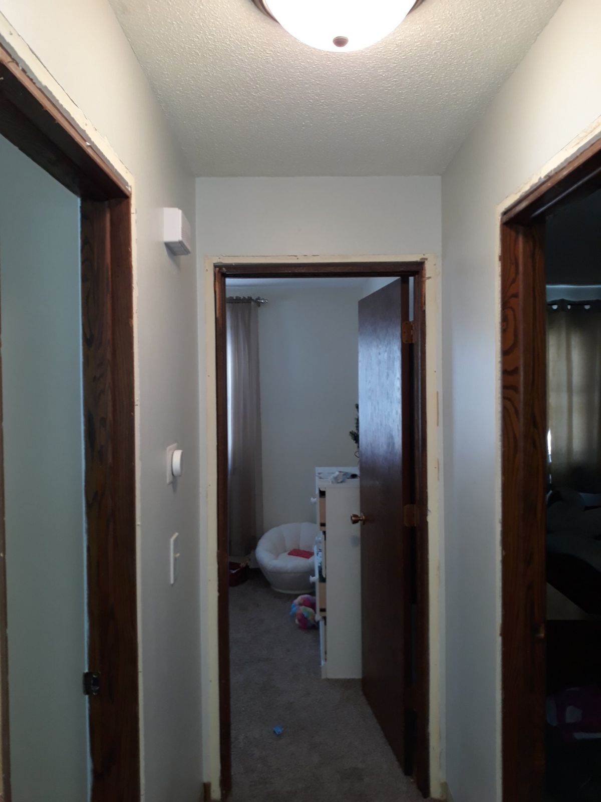 Main-floor hallway with trim removed before demolition