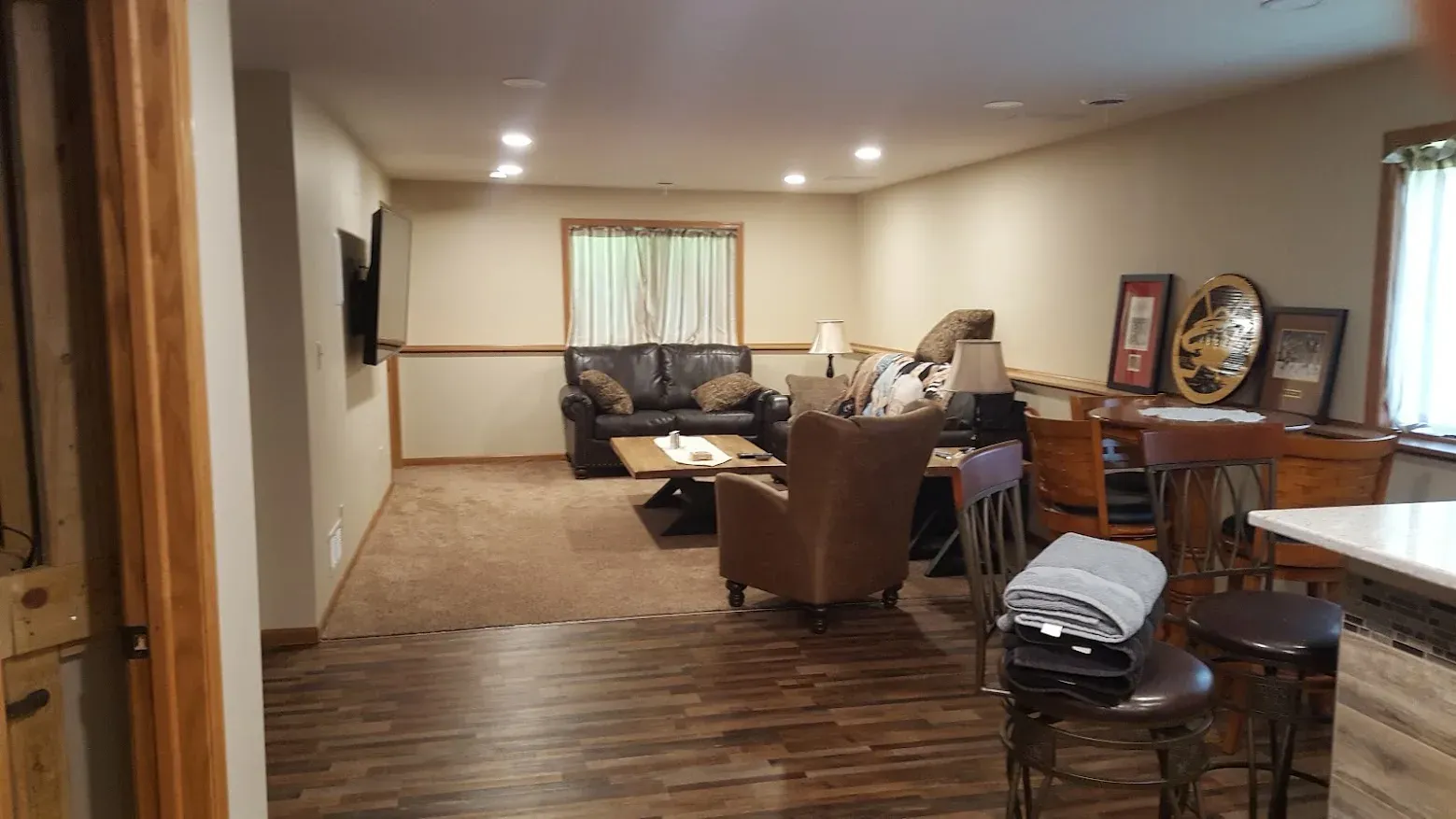 Finished basement family room with coordinated furniture layout