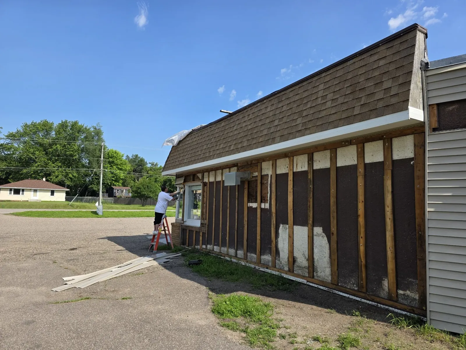 Exterior wall stripped to the studs for new siding installation