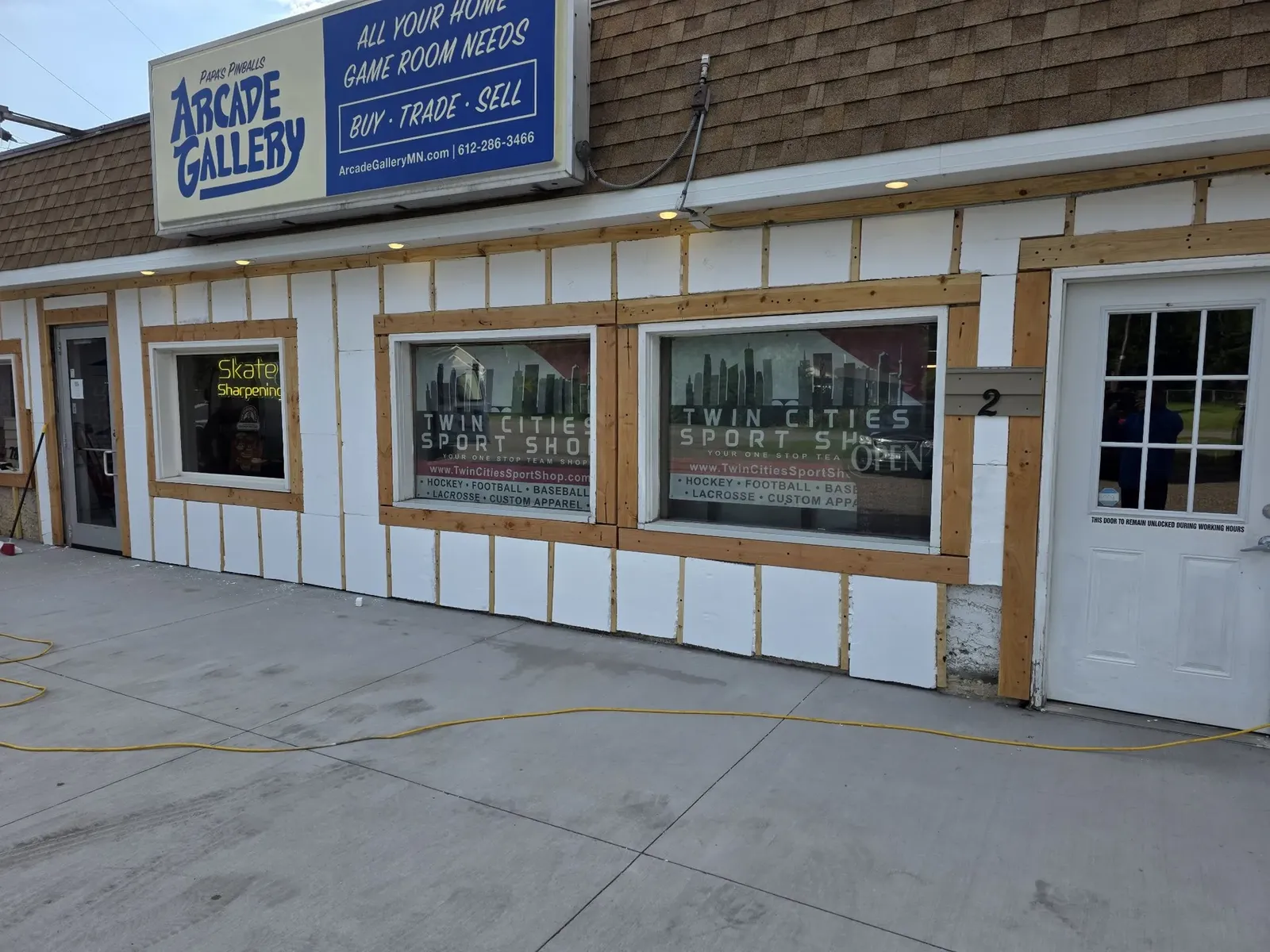 Finished performance center storefront with new siding, windows, doors, and trim