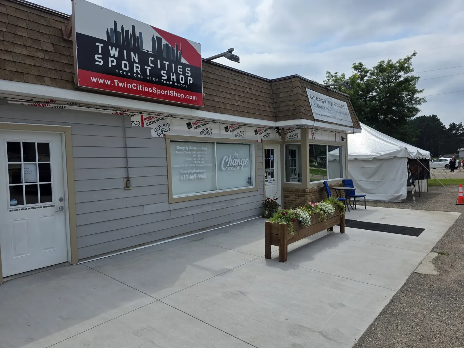 Finished gray siding and trim beneath the performance center storefront sign
