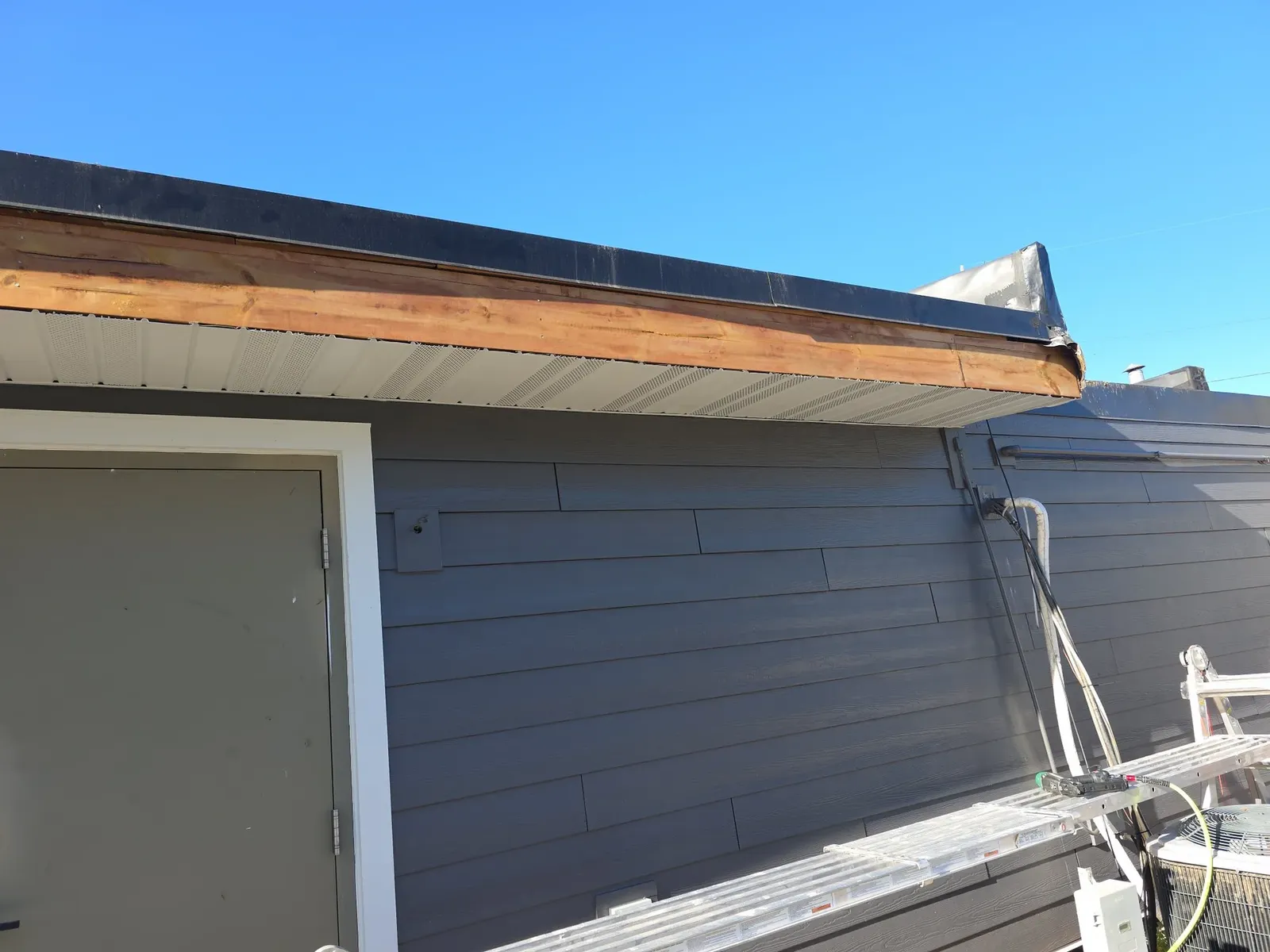 New soffit and fascia installed along the performance center roofline