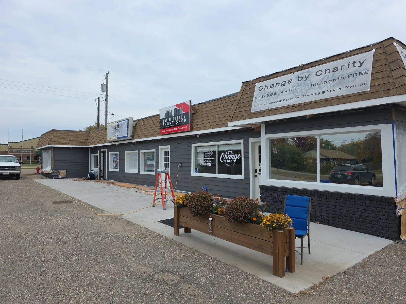 Finished performance center storefront with new siding, windows, and trim