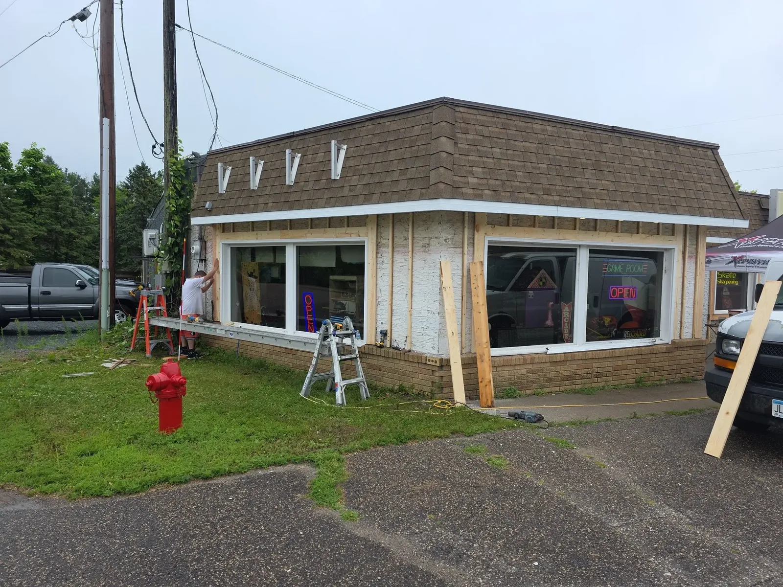Storefront corner with exterior framing exposed during renovation