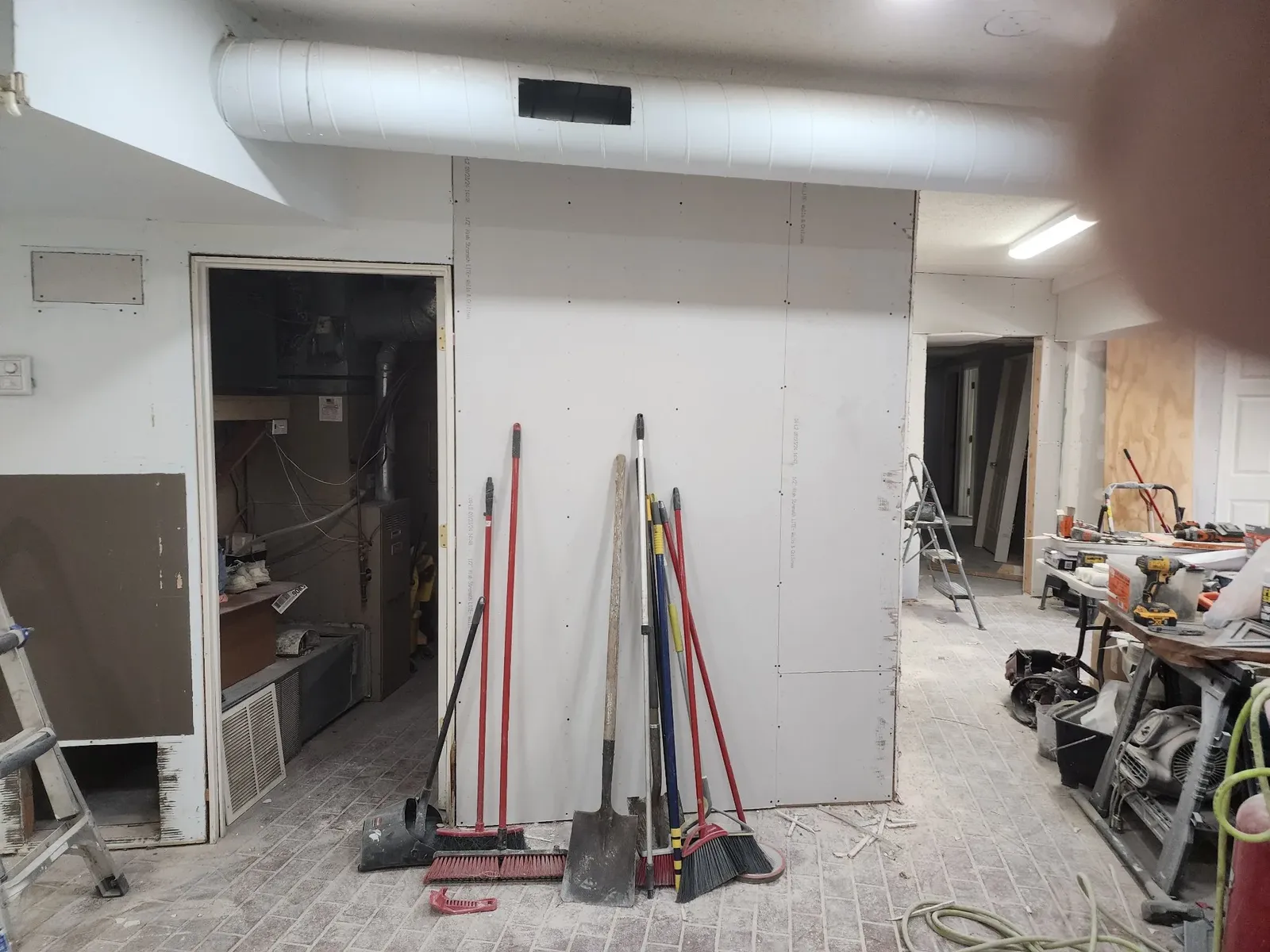 Drywall being installed in the commercial gym