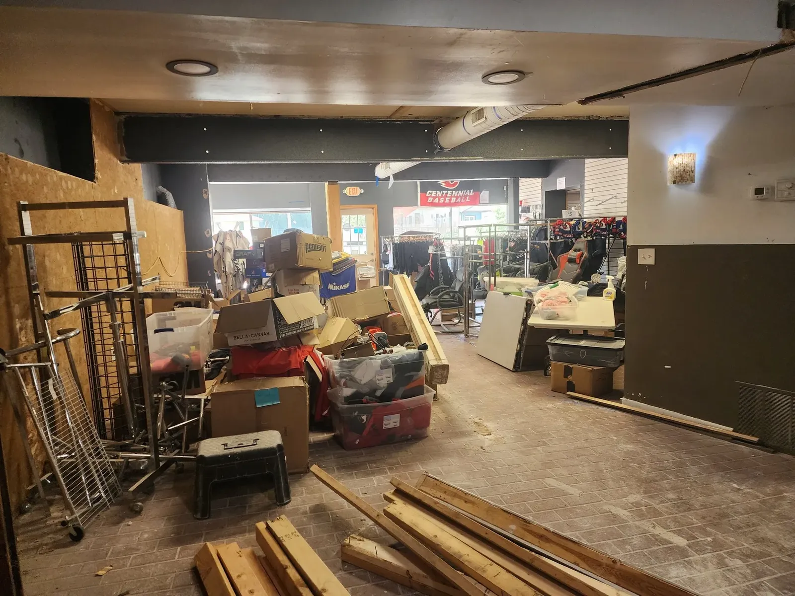 Cluttered storage room before the commercial gym renovation
