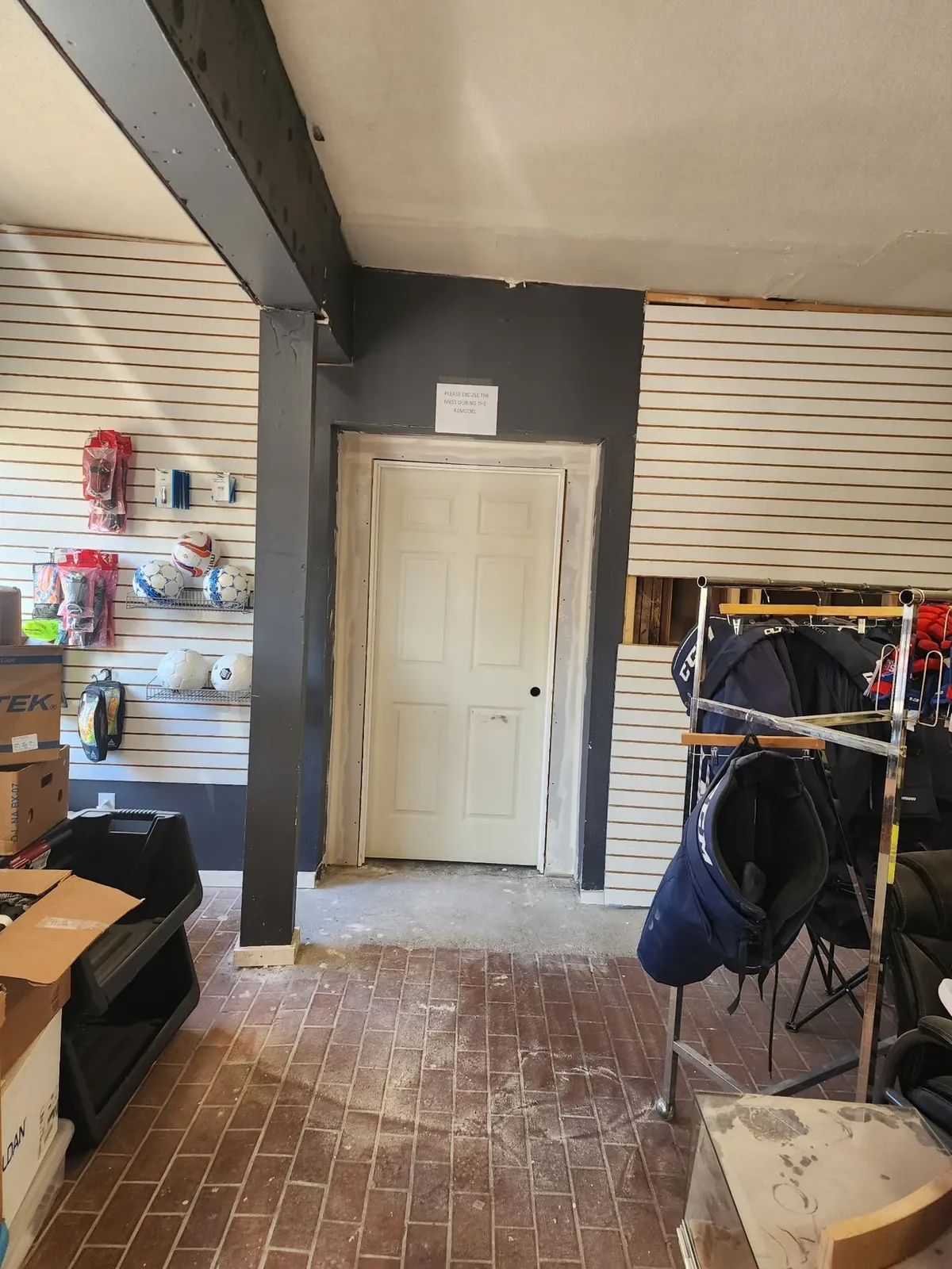 Interior doorway and work area during the commercial gym remodel