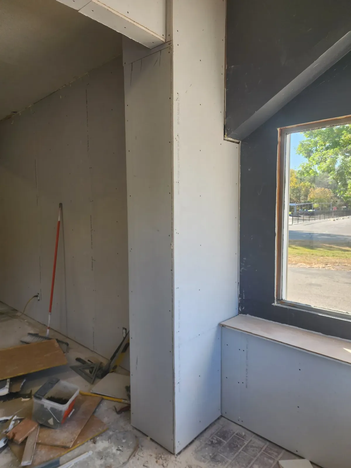 Room with newly hung drywall