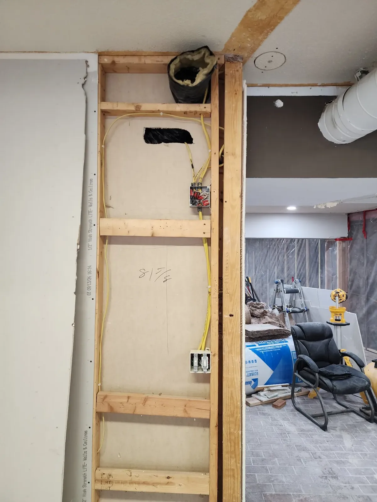Open wall with exposed electrical wiring